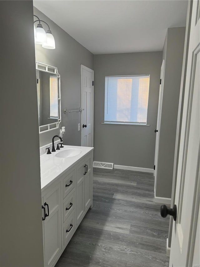 bathroom with vanity and hardwood / wood-style floors