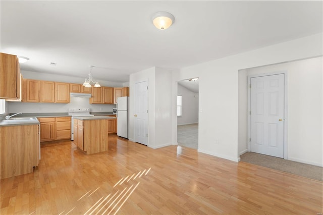 kitchen featuring sink, light hardwood / wood-style flooring, light brown cabinets, a kitchen island, and white appliances