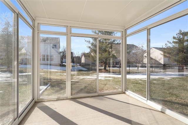 unfurnished sunroom with plenty of natural light