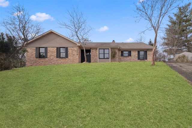 ranch-style house with a front lawn