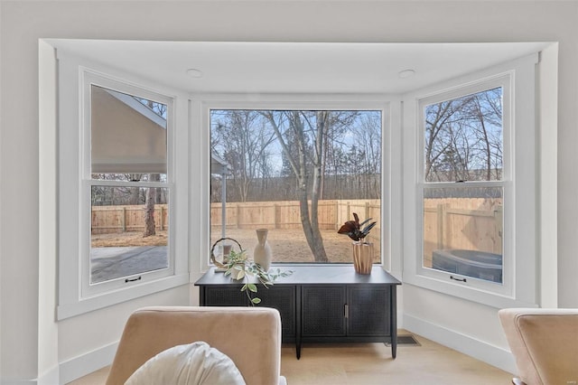 living area featuring light hardwood / wood-style flooring and plenty of natural light