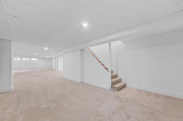 basement with light colored carpet