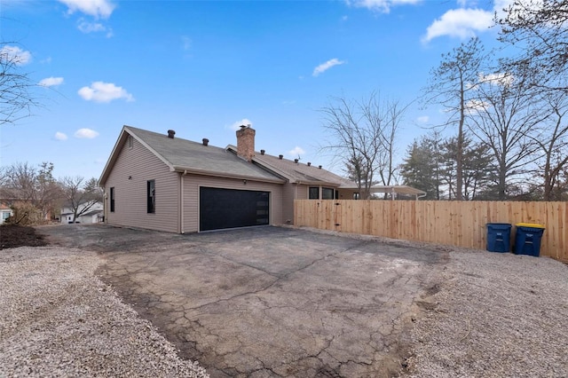 view of side of property featuring a garage