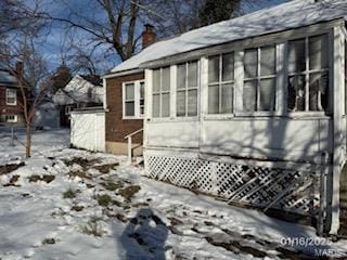 view of snow covered property