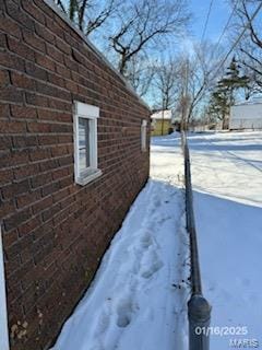 view of snow covered property