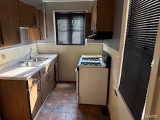 kitchen with sink and gas range gas stove