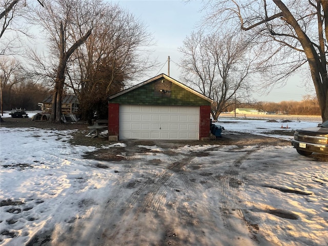 view of snow covered garage