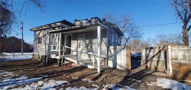 view of snow covered exterior with central AC