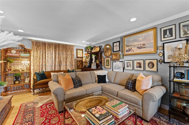 living room featuring crown molding and light hardwood / wood-style flooring