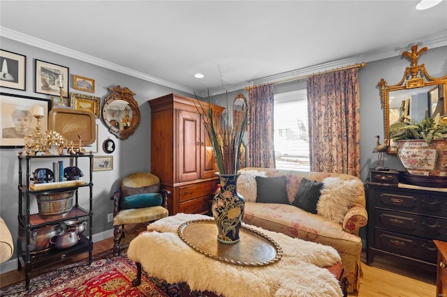 living room with ornamental molding and light wood-type flooring