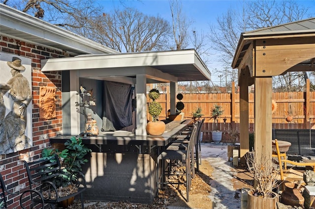 view of patio with exterior bar