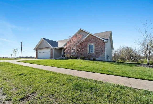 view of front facade with a garage and a front lawn