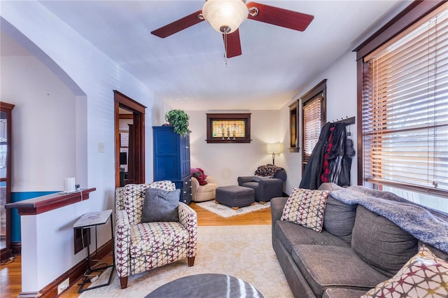 living room with ceiling fan and wood-type flooring