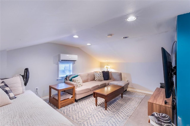 living room with vaulted ceiling, a wall mounted AC, and light hardwood / wood-style floors