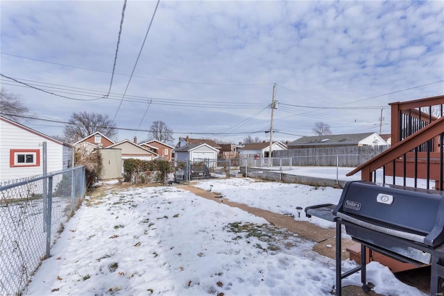 view of yard covered in snow