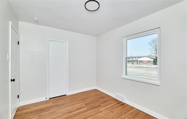 empty room featuring light hardwood / wood-style floors