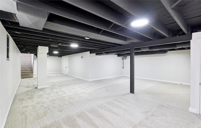 basement featuring carpet flooring