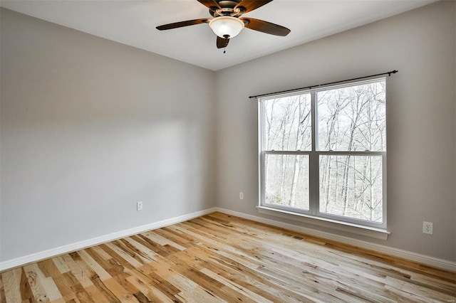 unfurnished room featuring light hardwood / wood-style floors and ceiling fan