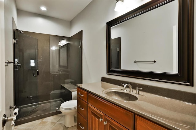 bathroom with vanity, an enclosed shower, tile patterned floors, and toilet