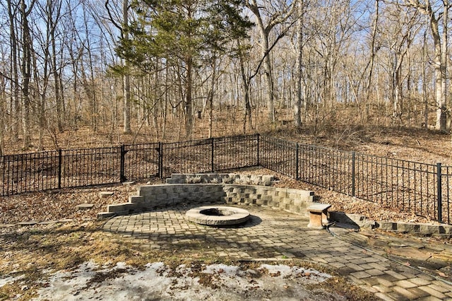 view of yard featuring an outdoor fire pit and a patio