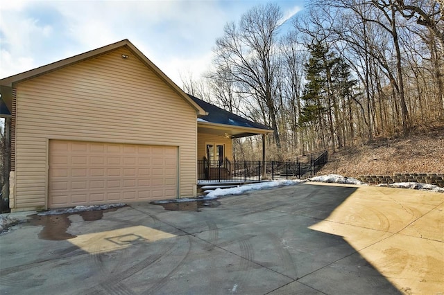 view of side of property featuring a garage