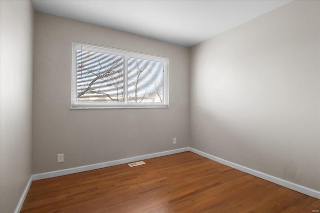 unfurnished room featuring hardwood / wood-style floors