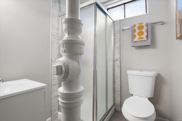 bathroom with toilet and an enclosed shower