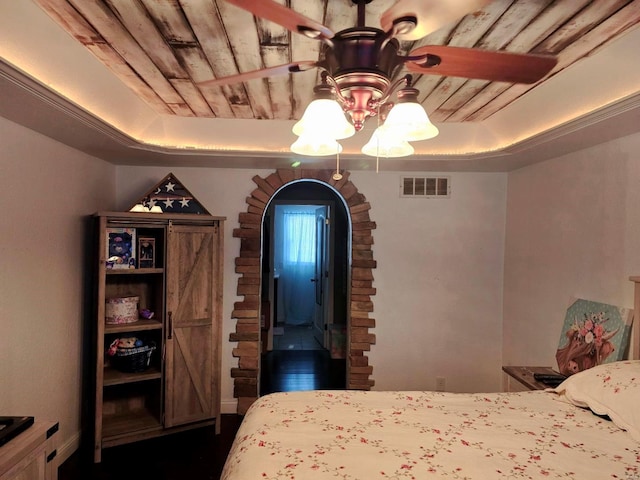 bedroom with a tray ceiling