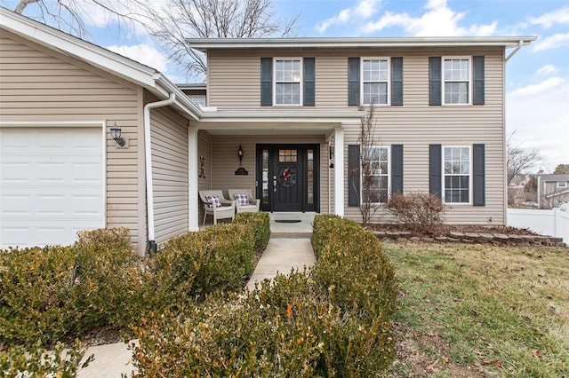 view of front of house featuring a garage and a front yard