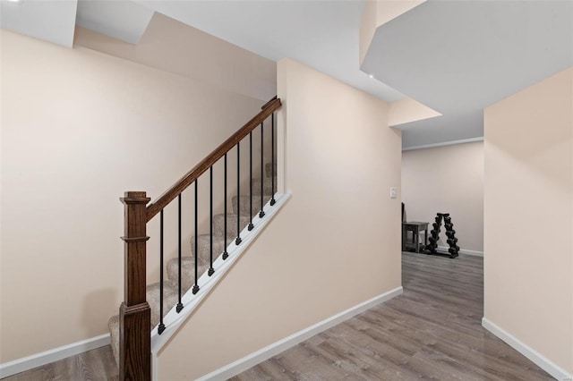 stairs with wood-type flooring