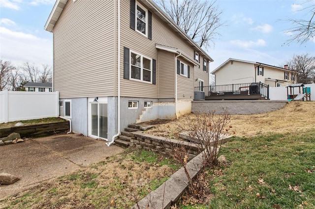 view of property exterior featuring a wooden deck and cooling unit