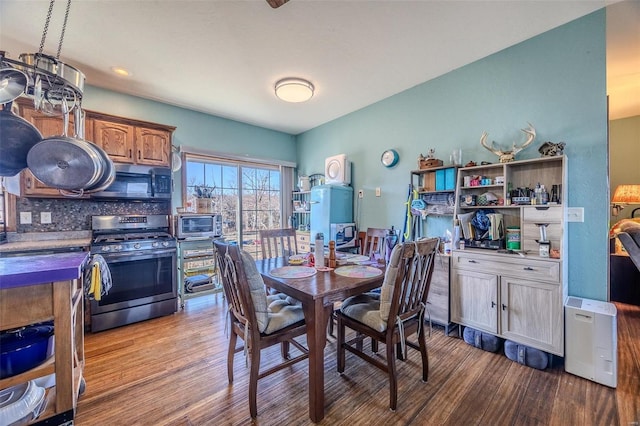 dining space with light hardwood / wood-style flooring