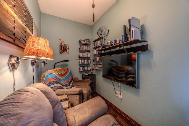 sitting room featuring vaulted ceiling