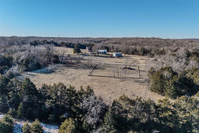 birds eye view of property with a rural view