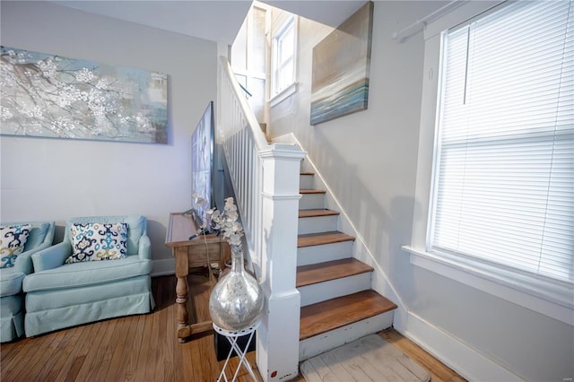 stairway featuring hardwood / wood-style flooring