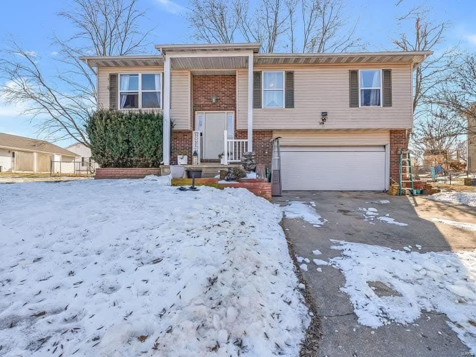 split foyer home featuring a garage