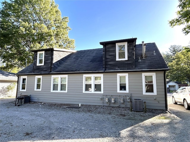 back of property featuring central AC unit