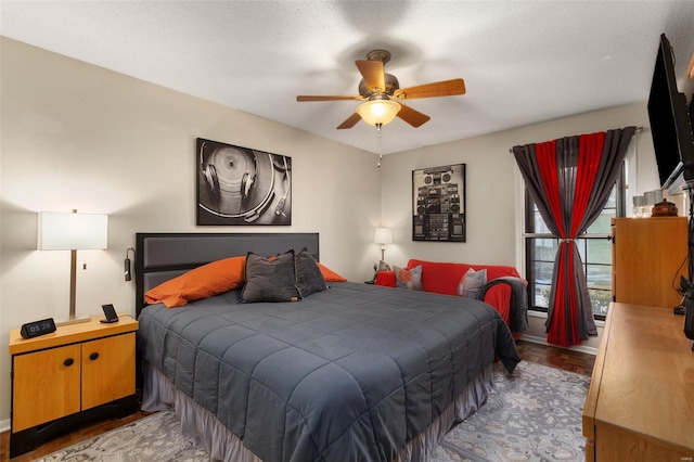 bedroom featuring a textured ceiling and ceiling fan