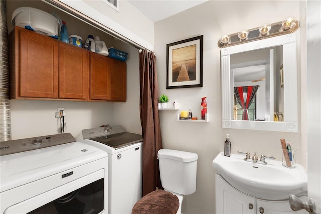 interior space with sink and washing machine and dryer