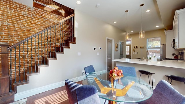 dining room featuring dark hardwood / wood-style flooring and sink