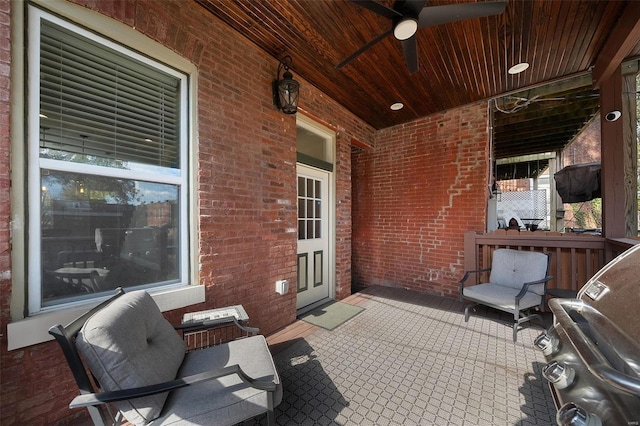 view of patio / terrace with ceiling fan, grilling area, and covered porch