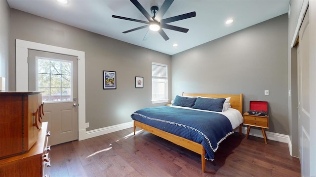 bedroom with dark wood-type flooring and ceiling fan