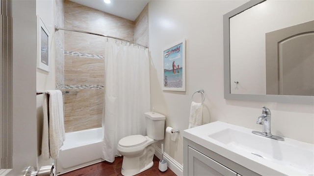 full bathroom with hardwood / wood-style flooring, shower / tub combo with curtain, vanity, and toilet