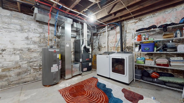 basement featuring separate washer and dryer and water heater