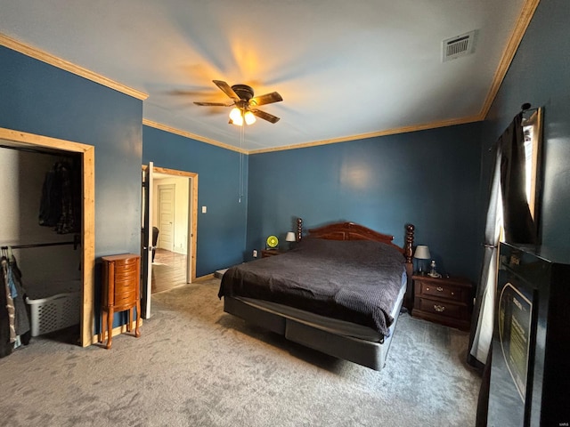 bedroom featuring ornamental molding, carpet, and ceiling fan