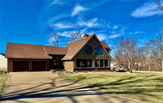 view of front of property with a garage and a front lawn