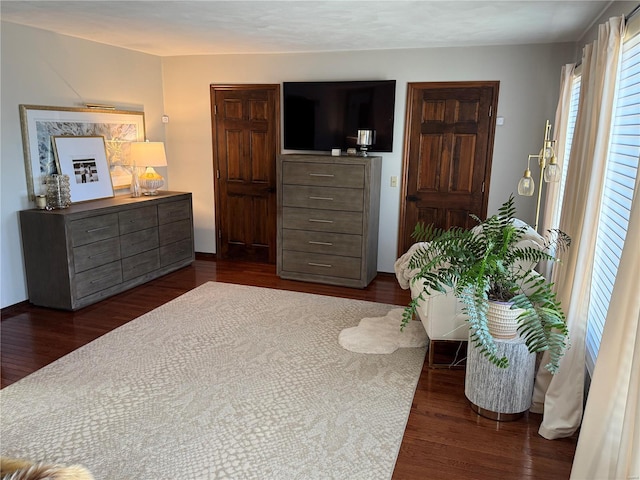 bedroom featuring dark wood-type flooring