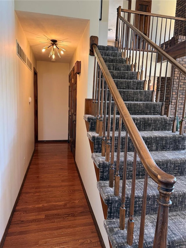 stairs with wood-type flooring