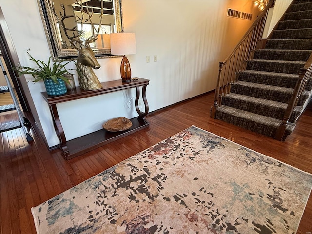 stairs featuring wood-type flooring