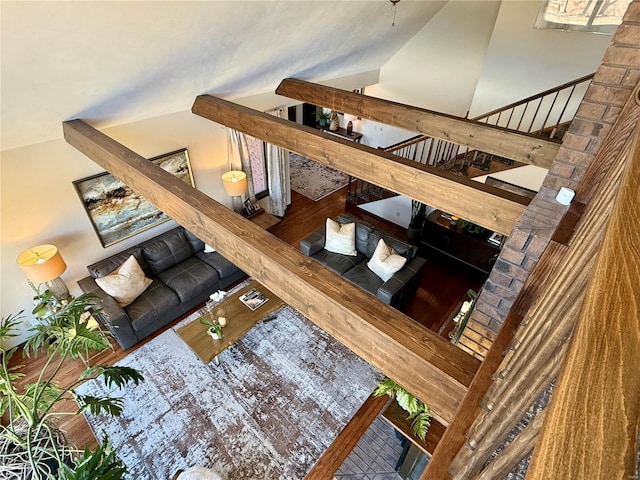 interior space featuring wood-type flooring and vaulted ceiling